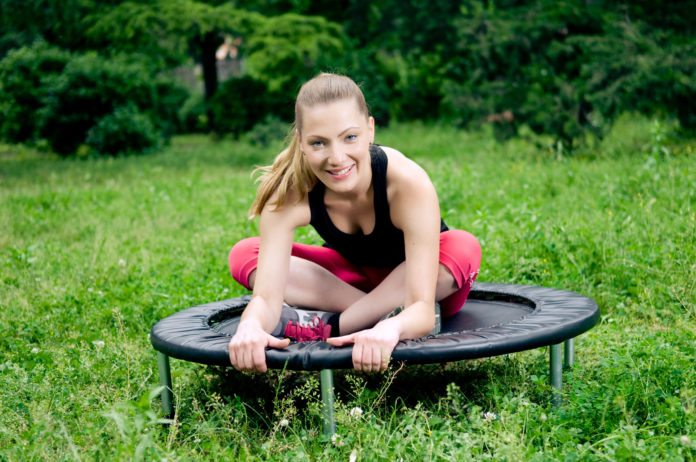 Woman working out with a workout trampoline