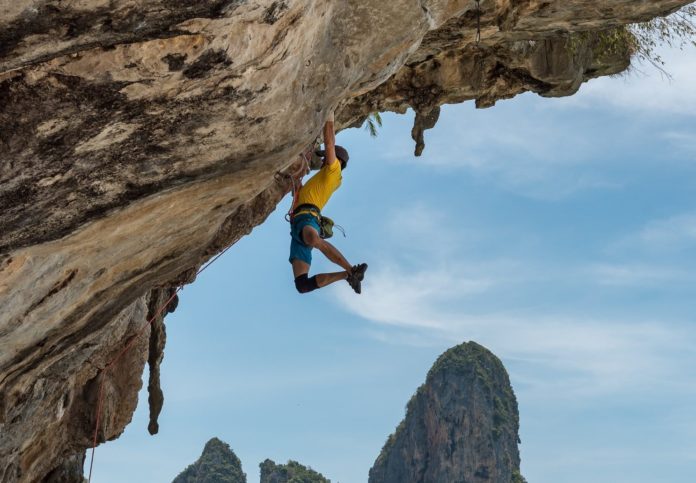 Man rock climbing in Thailand