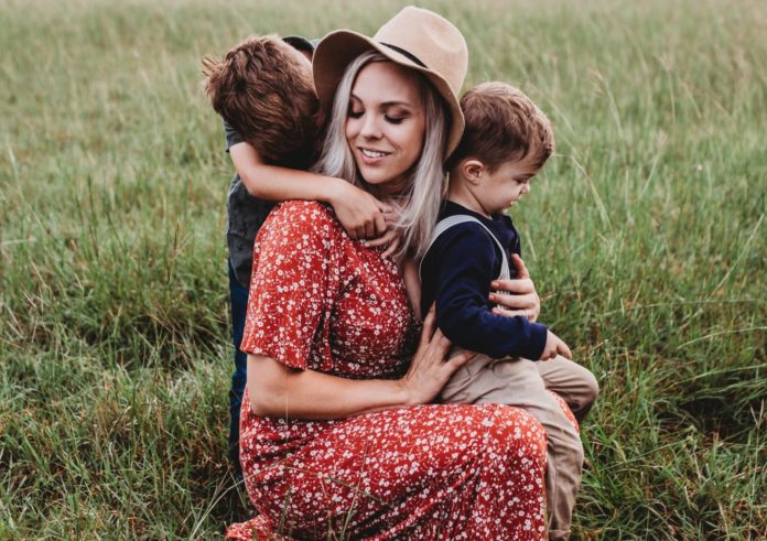 Mom with her two sons in a field