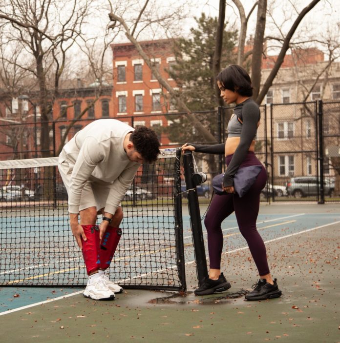 Man and woman on tennis court