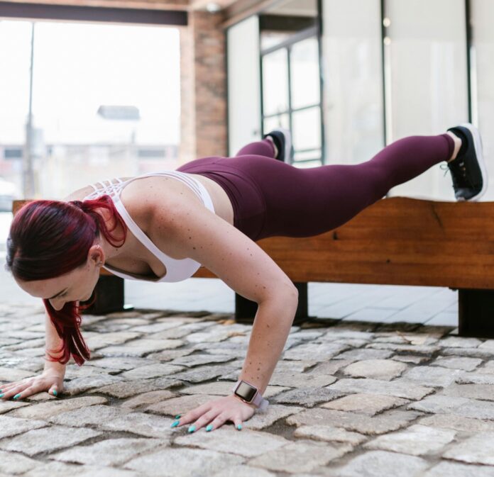 Woman Doing Push Ups on a bench