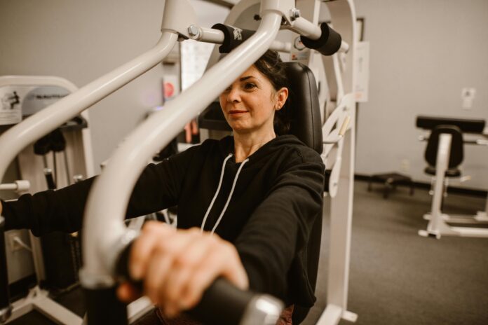 Woman working out, chest press